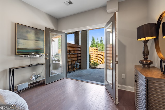 doorway with dark hardwood / wood-style flooring