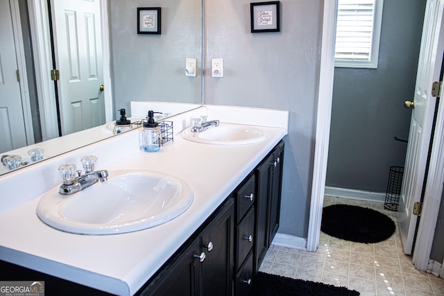 bathroom featuring tile patterned floors and vanity