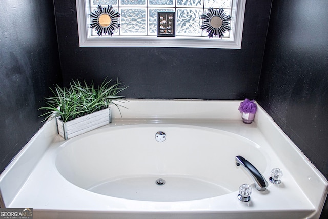 bathroom featuring a washtub