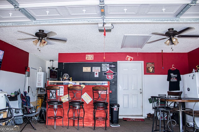 bar with carpet flooring and ceiling fan