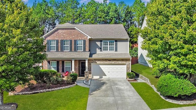 view of front of home featuring a front yard and a garage