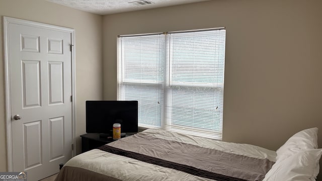 bedroom featuring a textured ceiling