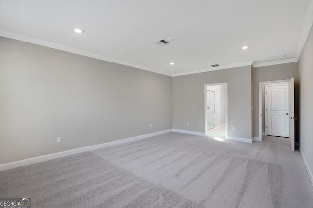 empty room featuring light carpet and ornamental molding