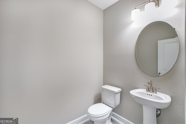 bathroom with sink and toilet