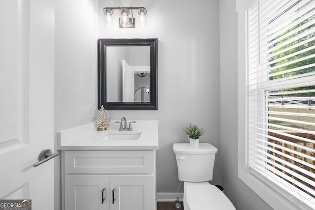 bathroom with vanity and toilet