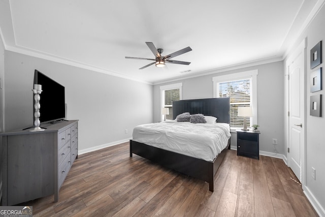 bedroom featuring ceiling fan, crown molding, and dark hardwood / wood-style flooring