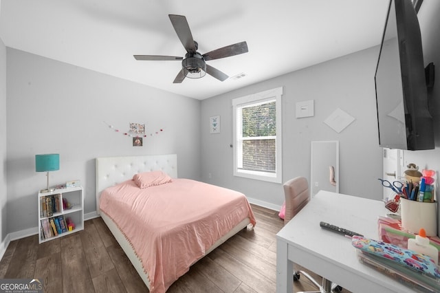 bedroom featuring ceiling fan and dark hardwood / wood-style floors