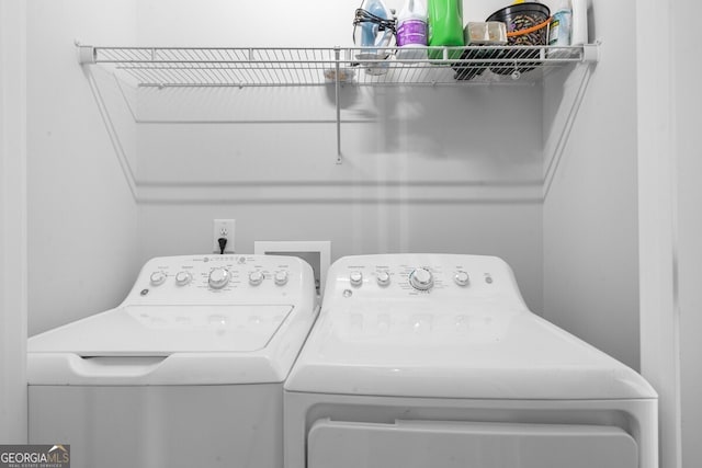 washroom with separate washer and dryer