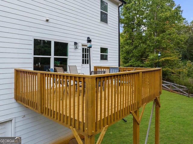 deck featuring a lawn