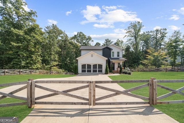 view of front of home featuring a garage and a front lawn