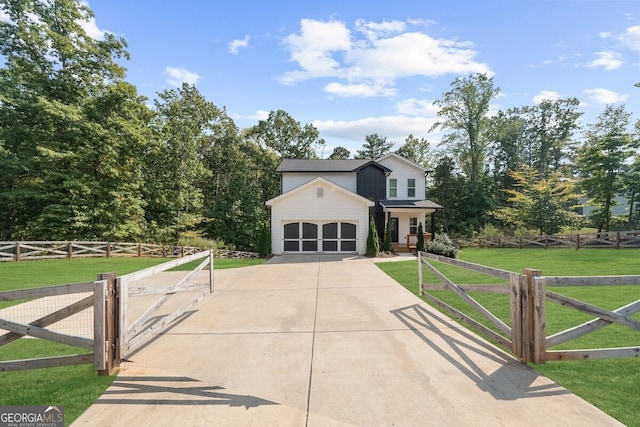 view of front of home featuring a front yard and a garage