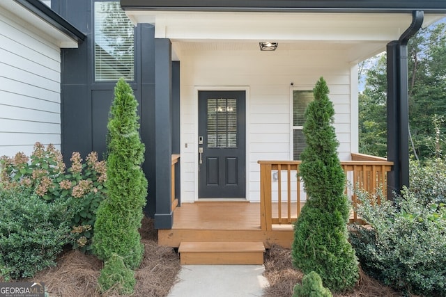 property entrance featuring covered porch