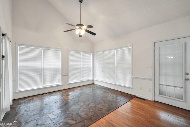 interior space with vaulted ceiling and ceiling fan