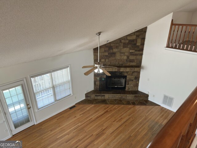 bonus room featuring vaulted ceiling, ceiling fan, carpet floors, and a textured ceiling