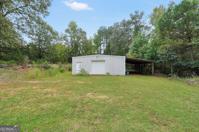 view of outbuilding with a yard and a garage