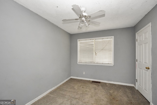 empty room with carpet floors and ceiling fan