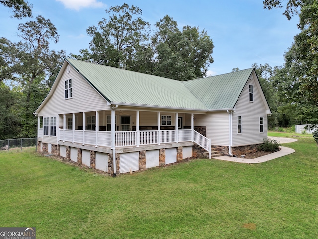 view of front of house featuring a front yard and a porch