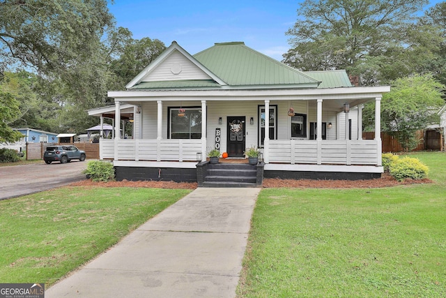 farmhouse featuring a front lawn and a porch