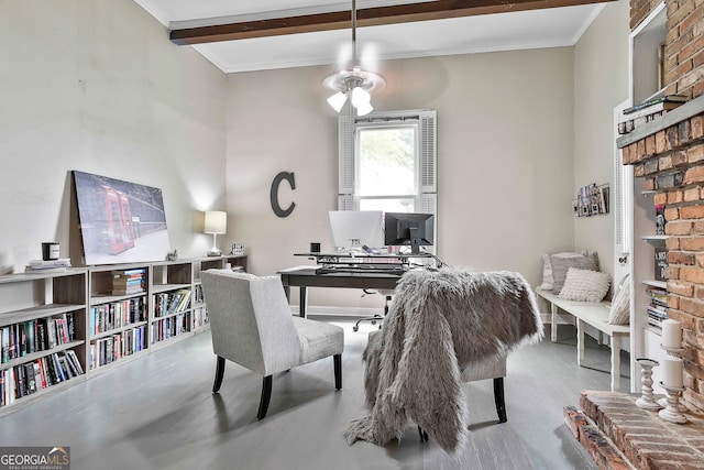 office area with ornamental molding, light wood-type flooring, and beamed ceiling