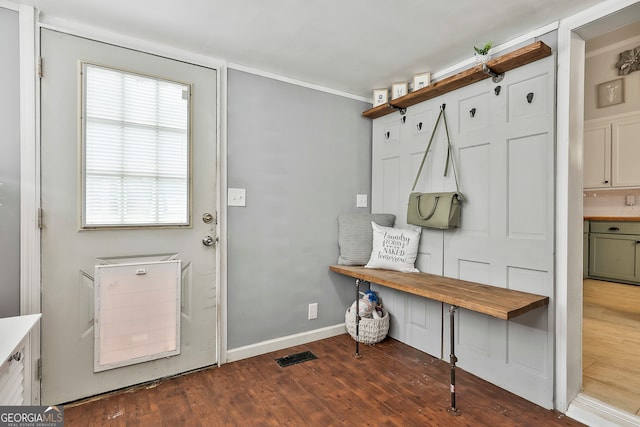 mudroom featuring dark hardwood / wood-style floors and ornamental molding