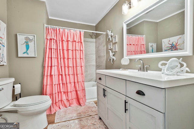 full bathroom featuring vanity, toilet, ornamental molding, hardwood / wood-style floors, and shower / tub combo with curtain