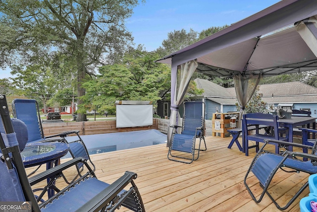 wooden terrace with a gazebo