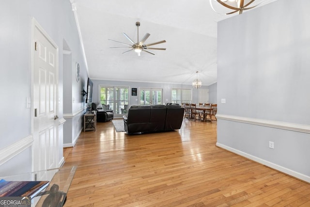 1011 Sugar Hill Way, Buckhead, GA 30625 - living area featuring baseboards, ceiling fan with notable chandelier, light wood finished floors, and lofted ceiling