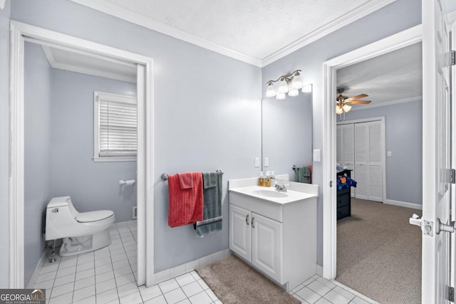 bathroom with vanity, tile patterned flooring, ceiling fan, ornamental molding, and a textured ceiling