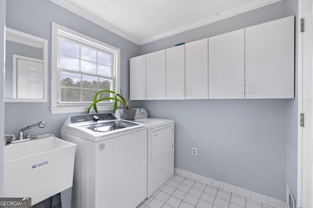 1011 Sugar Hill Way, Buckhead, GA 30625 - laundry area featuring cabinet space, a sink, washing machine and dryer, visible vents, and ornamental molding