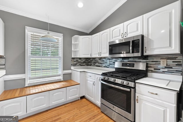 1011 Sugar Hill Way, Buckhead, GA 30625 - kitchen with appliances with stainless steel finishes, tasteful backsplash, light countertops, white cabinets, and ornamental molding
