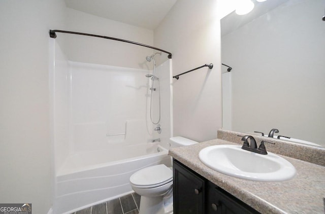 full bathroom featuring tub / shower combination, vanity, and toilet