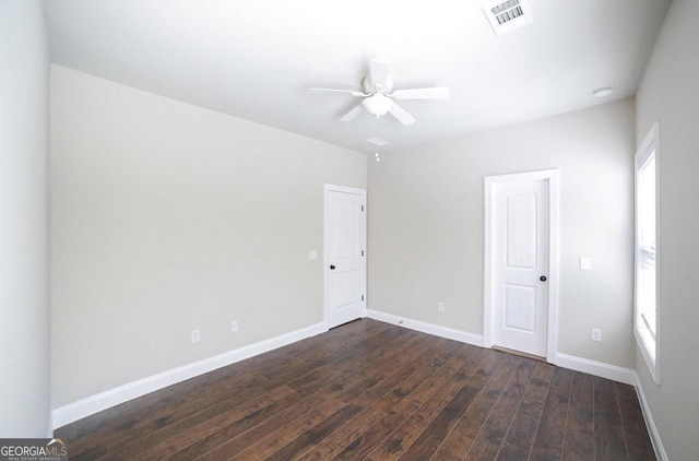 unfurnished room featuring ceiling fan and dark hardwood / wood-style flooring