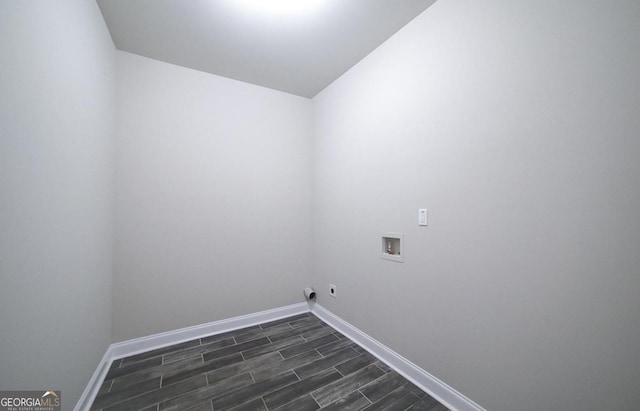 washroom with washer hookup, electric dryer hookup, and dark wood-type flooring