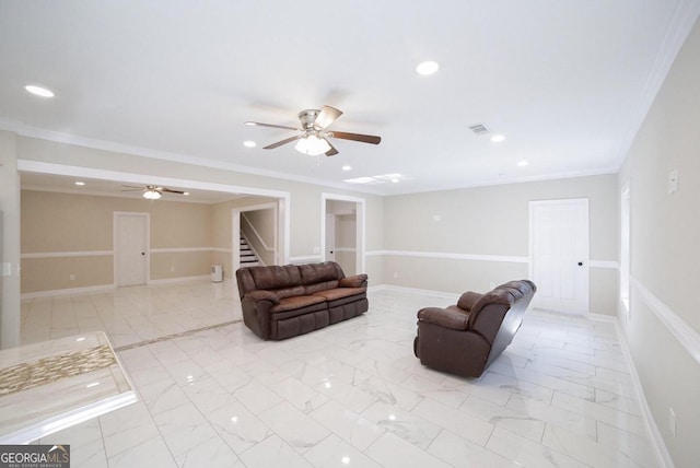 living room with ceiling fan and crown molding