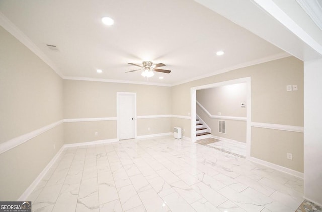 unfurnished room with ceiling fan and crown molding