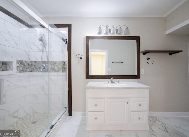 bathroom with ornamental molding, vanity, and a shower with shower door