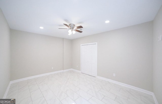 unfurnished room with ceiling fan