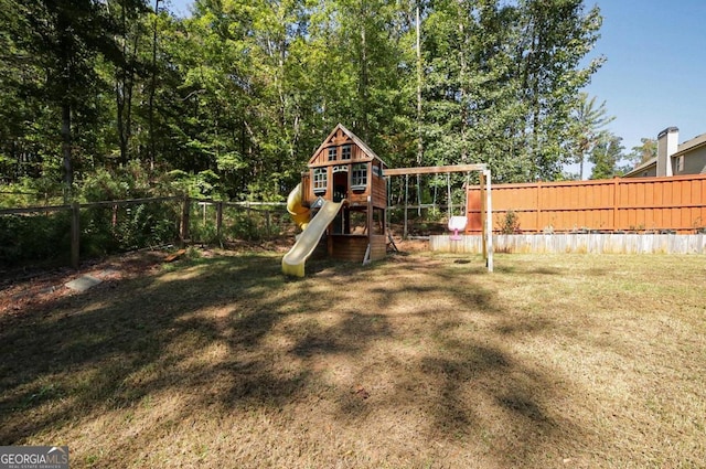 view of playground with a yard