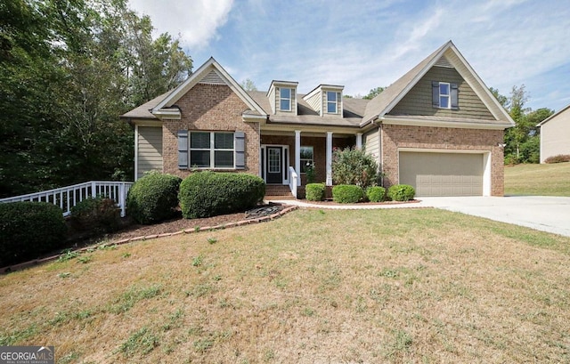 craftsman-style home with a front lawn, a porch, and a garage