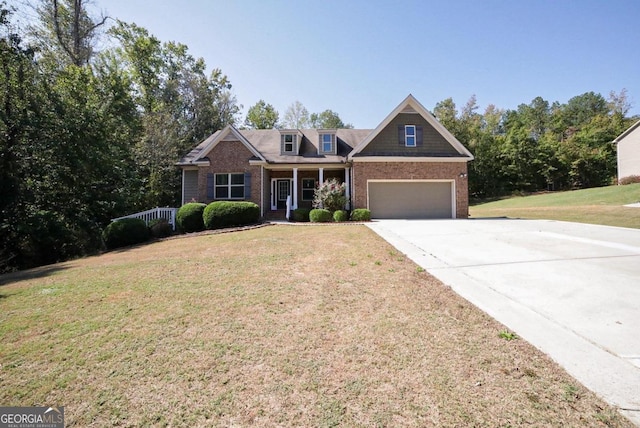 view of front of property with a garage and a front yard