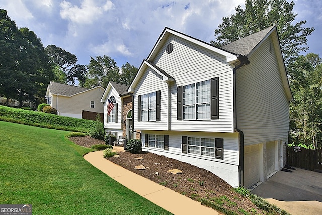 view of front facade featuring a garage and a front lawn