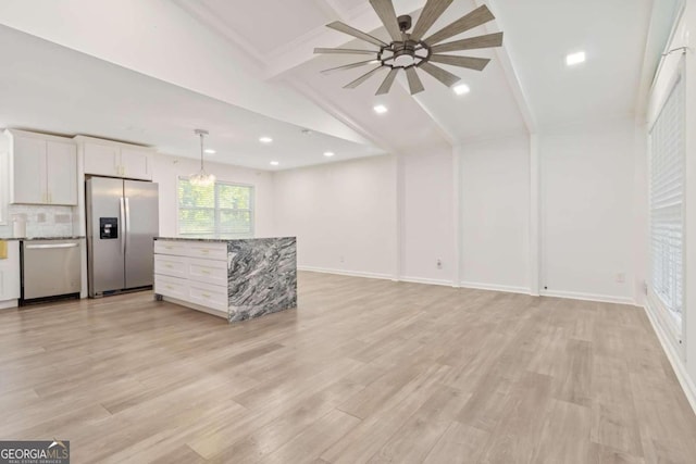 unfurnished living room featuring light wood-type flooring, lofted ceiling with beams, and a chandelier