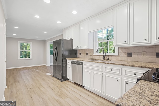 kitchen featuring ornamental molding, white cabinetry, sink, and dishwasher