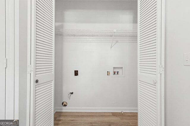 laundry room featuring hookup for a washing machine and light wood-type flooring