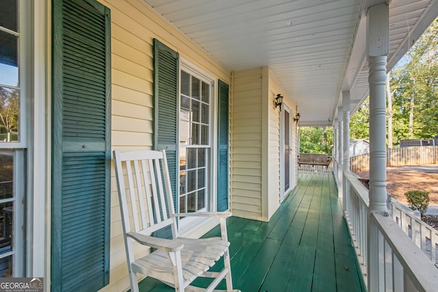 wooden deck featuring covered porch