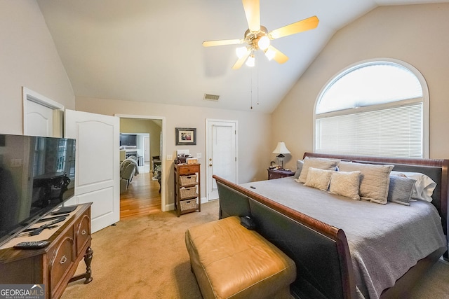 carpeted bedroom with lofted ceiling and ceiling fan