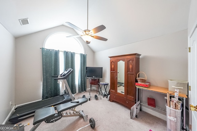 workout area featuring lofted ceiling, carpet flooring, and ceiling fan