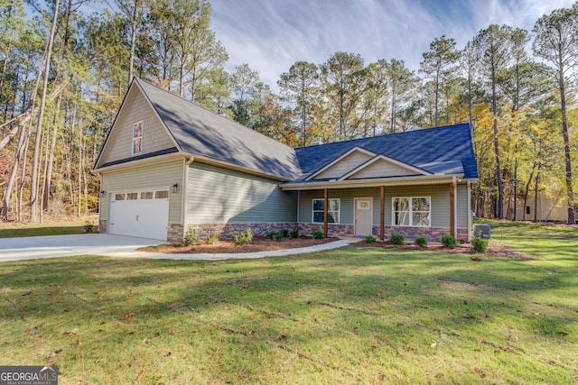 view of front of house with a garage and a front lawn