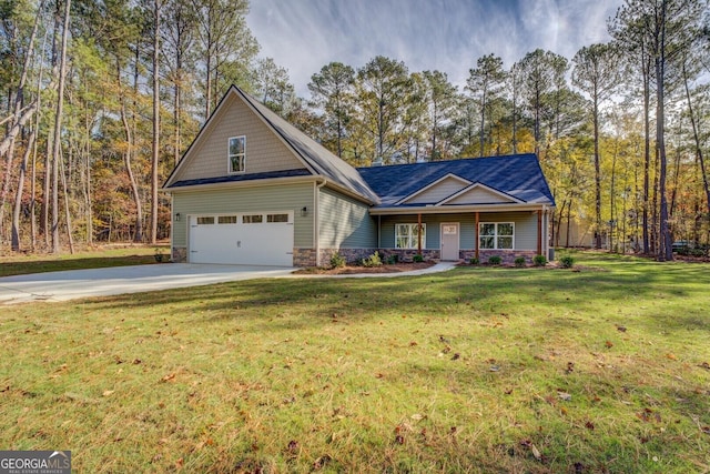 view of front of house featuring a garage and a front yard