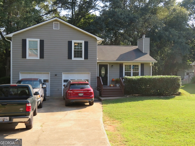 split level home featuring a front lawn and a garage